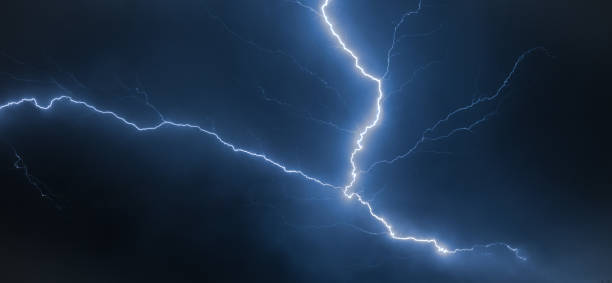 istock Branched lightning bolt high up in the sky, also known as an anvil crawler. 1162378839
