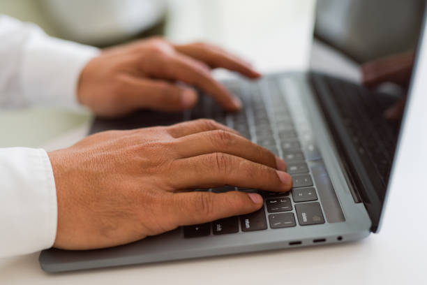 istock Close up of business man working using computer laptop 1162381059