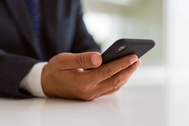 istock Close up of business man hands using smarpthone 1162381182