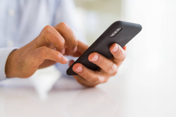 istock Close up of business man hands using smarpthone 1162381678