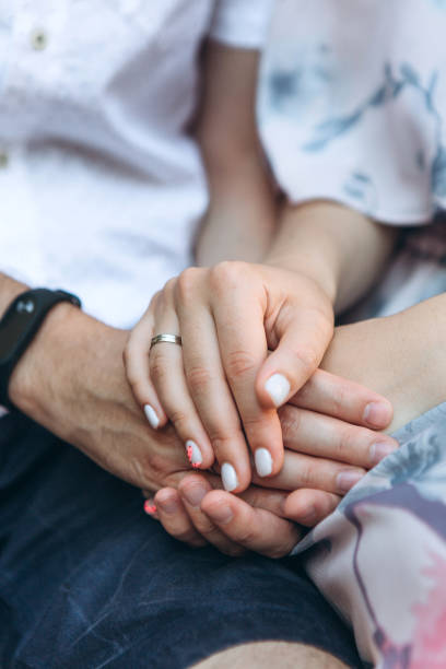 istock Man and woman hold hands 1162384209