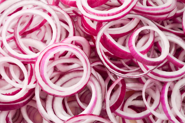 istock Onion rings as a background. Top view. 1162384418