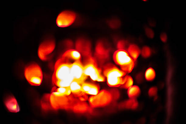 istock Blurred colored bokeh on black background. Glowing bokeh lights in the dark, reflections and highlights of different colors. Garland glows at night 1162387405