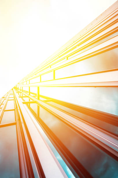 istock underside panoramic and perspective view to steel blue glass high rise building skyscrapers, business concept of successful industrial architecture 1162387620