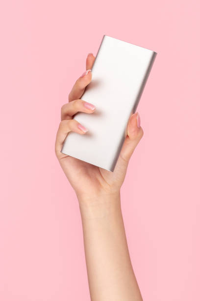 istock Crop female hand with silver power bank 1162388034