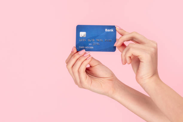istock GIrl showing credit card 1162388049