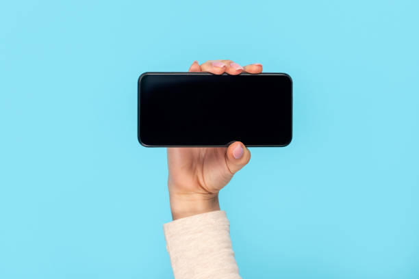 istock Woman demonstrating modern smartphone 1162388063