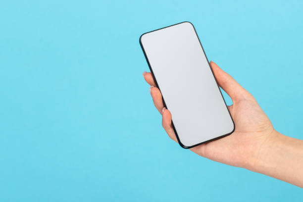 istock Woman holding contemporary mobile phone 1162388075