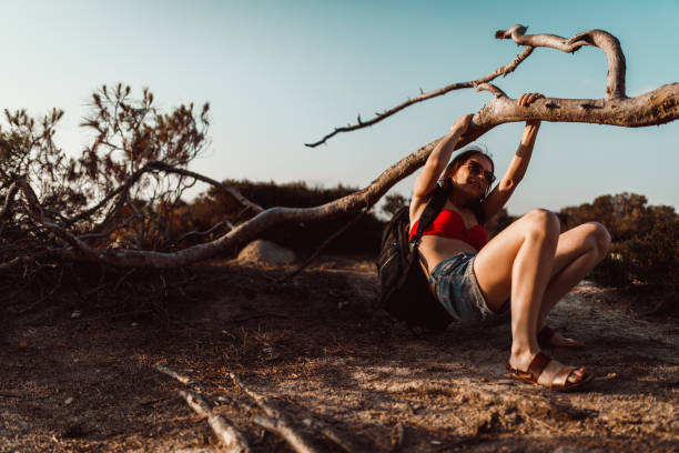 istock Woman with a backpack exploring seacoast in Greece 1162388362