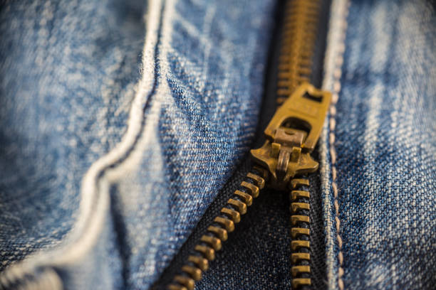 istock Closeup on blue jeans zipper and button 1162388451