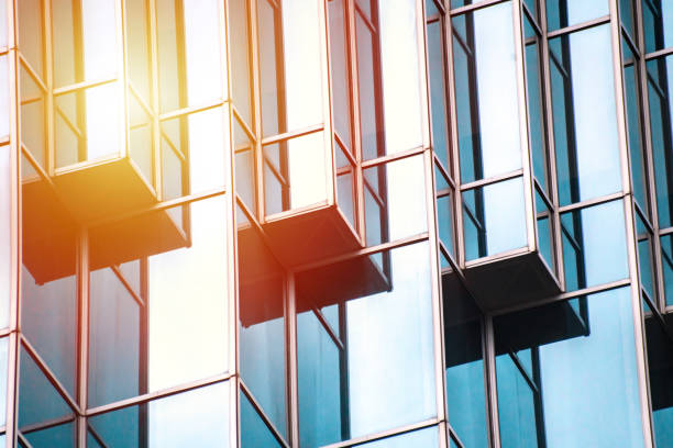 istock underside panoramic and perspective view to steel blue glass high rise building skyscrapers, business concept of successful industrial architecture 1162389619