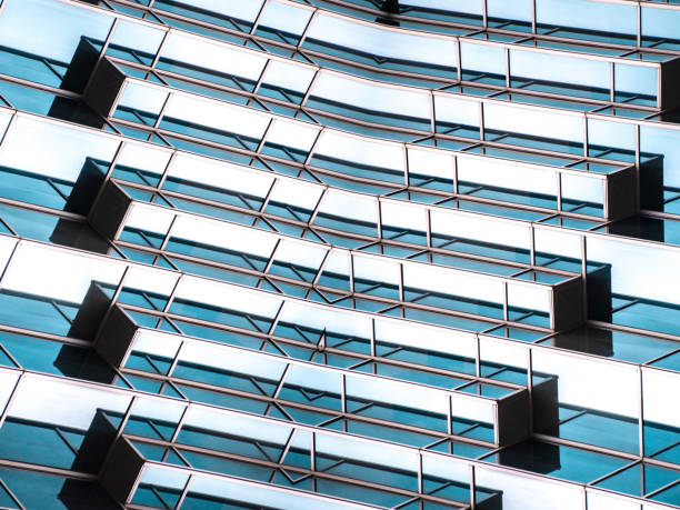 istock underside panoramic and perspective view to steel blue glass high rise building skyscrapers, business concept of successful industrial architecture 1162389737