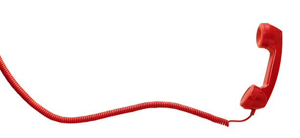 Red vintage telephone handset isolated on white background with copy space