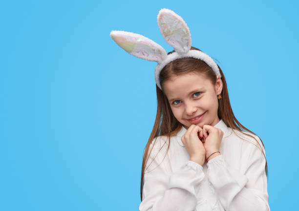 istock Cute girl in white ears looking at camera 1162390921