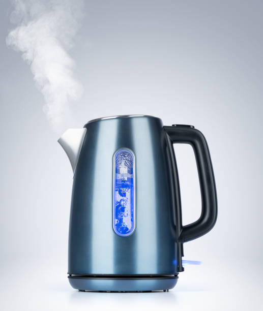 istock Boiling electric kettle gives off steam on background 1162393807