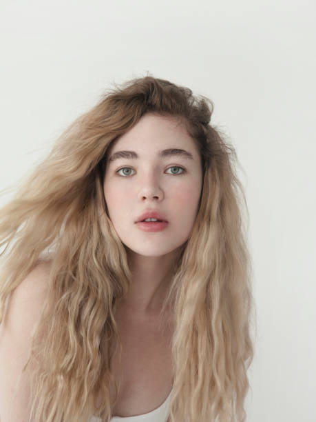 Young Beauty Dreamlike Girl Natural Blond Long Curly Wavy Hair Blue Eyes  Fashion Model Closeup Portrait Stock Photo - Download Image Now - iStock