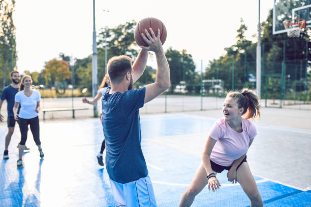 istock Friends Playing Basketball Outside 1162396656