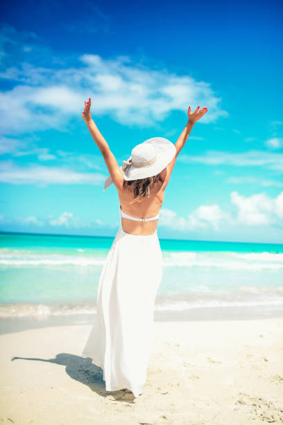 istock Elegant Female Enjoying Vast Sea Horizon 1162396830
