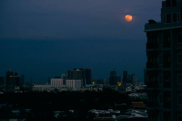 istock full moon and city night with grain 1162399029
