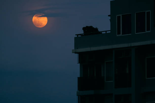 istock full moon and city night with grain 1162399131