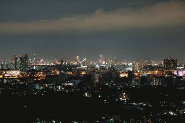 istock City view at night with beautiful lights with grain. 1162399951