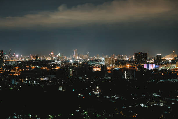 istock City view at night with beautiful lights with grain. 1162400108