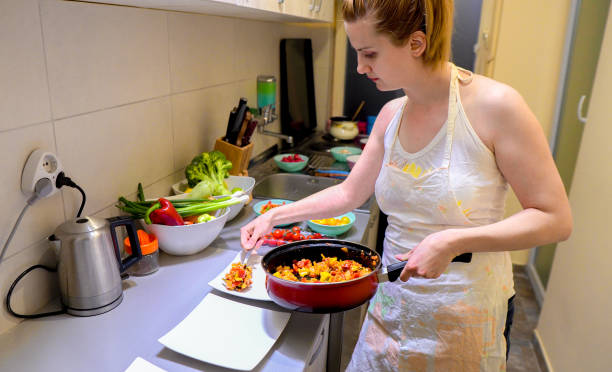 istock Woman make vegan dinner 1162400673