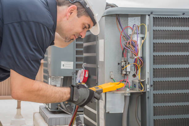 istock Hvac repair man reading a volt meter outside 1162401059