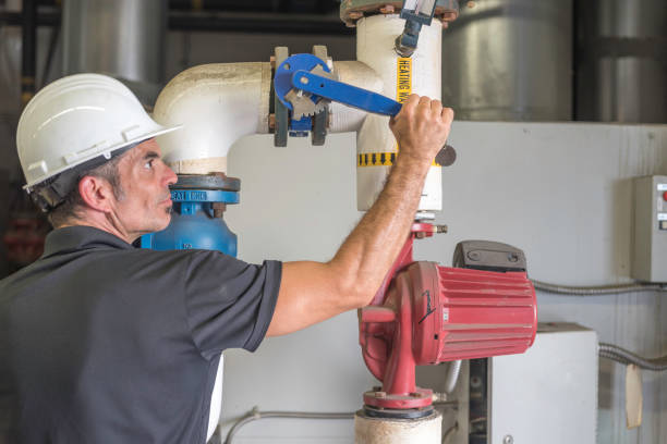 istock Hvac mechanic, shutting down on a boiler valve 1162401124