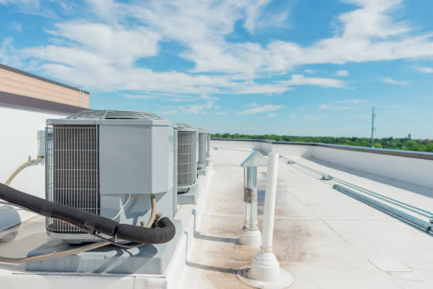 istock Row of Rooftop Air Conditioners 1162401164