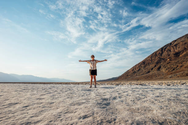 Young adult woman in Badwater basin, Death Valley Young adult woman in Badwater basin, Death Valley great basin national park stock pictures, royalty-free photos & images