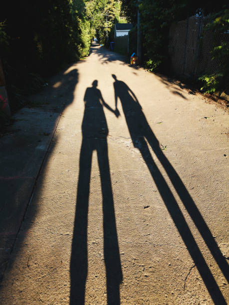 istock Shadow of a couple holding hands 1162404099