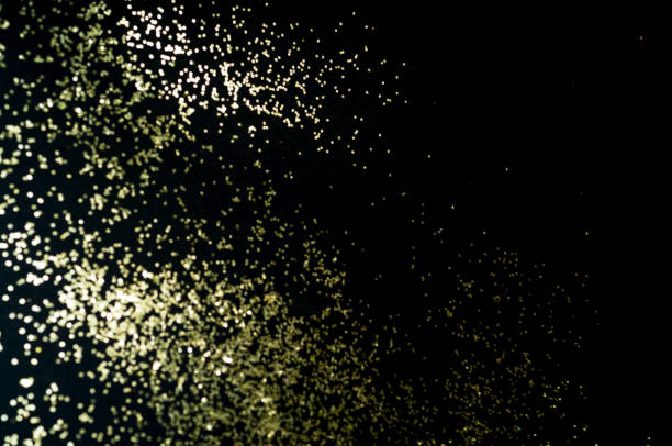 istock Black background with golden sparkles. Blurred  effect. Concept for festive background 1162405162