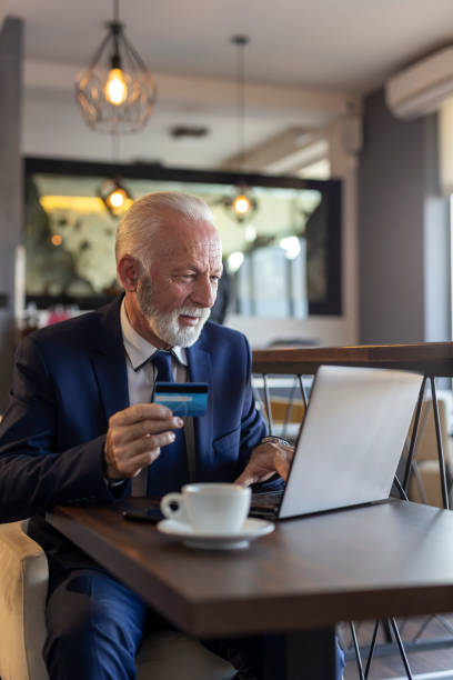 istock Senior businessman purchaing online 1162405761