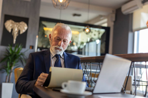 istock Senior businessman signing documentation 1162405935