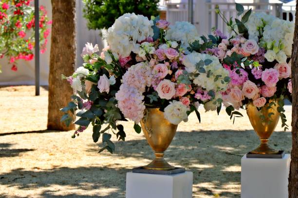 istock Colorful peonies arrangement in bronze vases. 1162406103