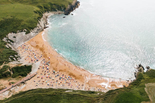 istock Crowded beach in summer as seen from above 1162407087
