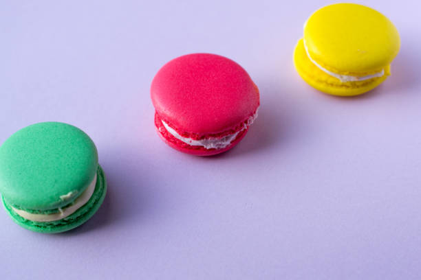 istock Close-up shot of colored macaroons in different position 1162408141
