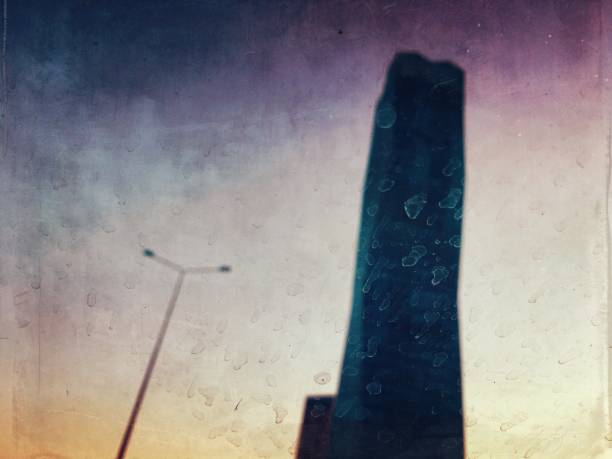 istock Defocused view of tower and street light 1162409516