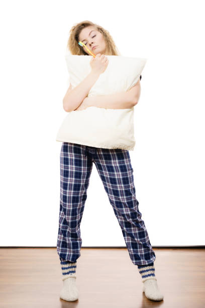 istock Sleepy woman wearing pajamas 1162409600