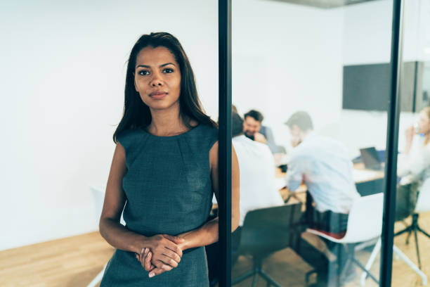 istock Business woman with his team behind 1162409771