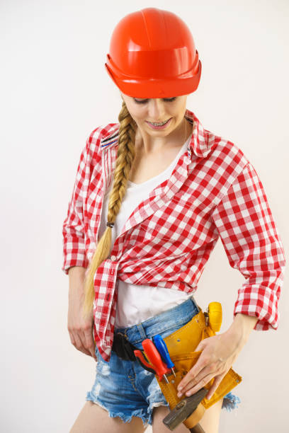 istock Happy woman in protective helmet 1162411617