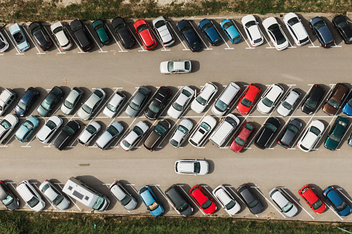 Directly abvoe view of a crowded parking lot