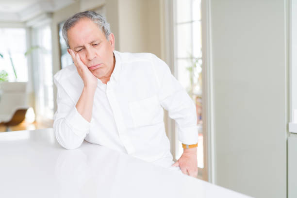 istock Handsome senior man at home thinking looking tired and bored with depression problems with crossed arms. 1162413461