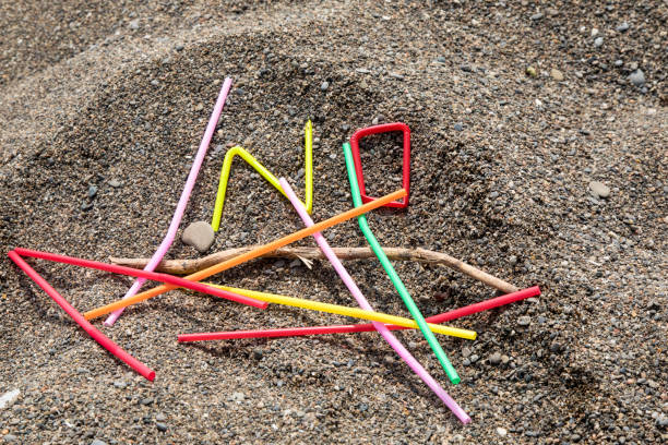 istock colorful single use plastic straws garbage washed up on the beach spelling the word or symbol No llustrating stop pollution 1162414728