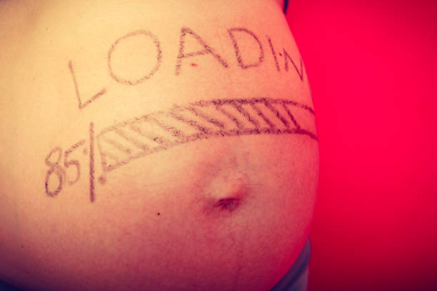 istock Pregnant woman belly with drawings 1162414970
