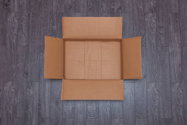 Cardboard boxes in an otherwise empty apartment where someone is moving homes.