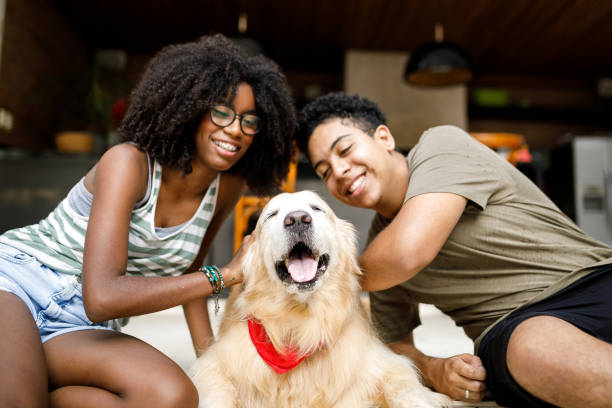 istock Two teenagers with their dog 1162416383