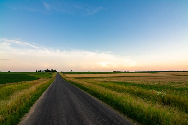 istock Open country road at sunset 1162423620