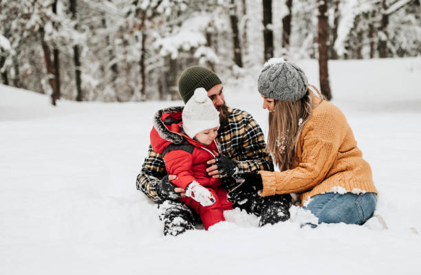 istock Let's cover up mum with snow 1162423650